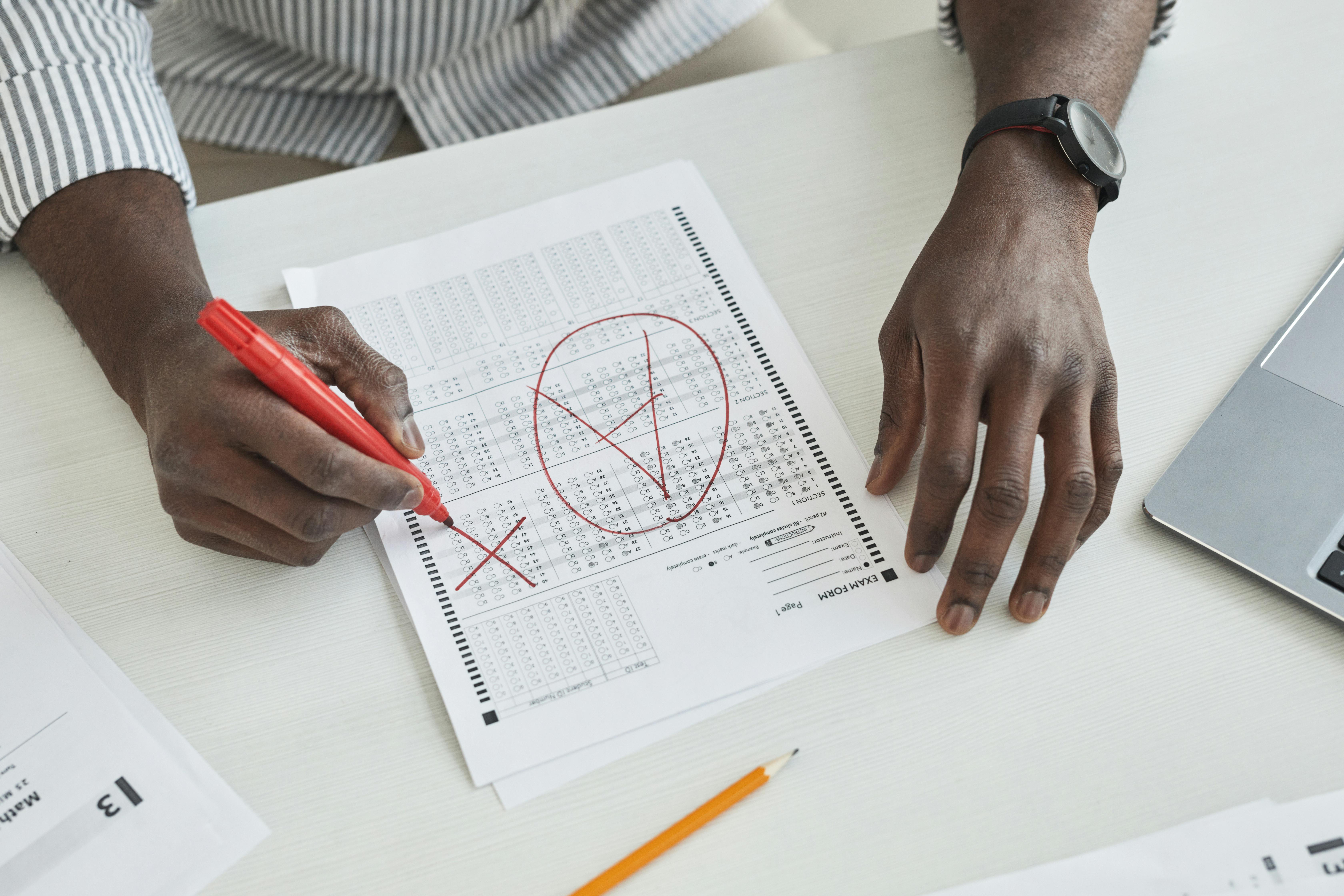 A photo of someone grading papers.